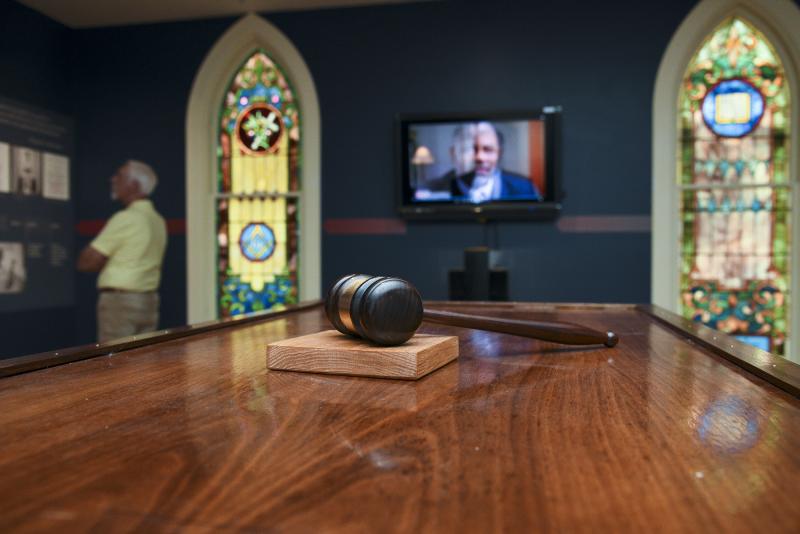 In the center of the gallery, John Chirtea built judge’s bench where a gavel rests.